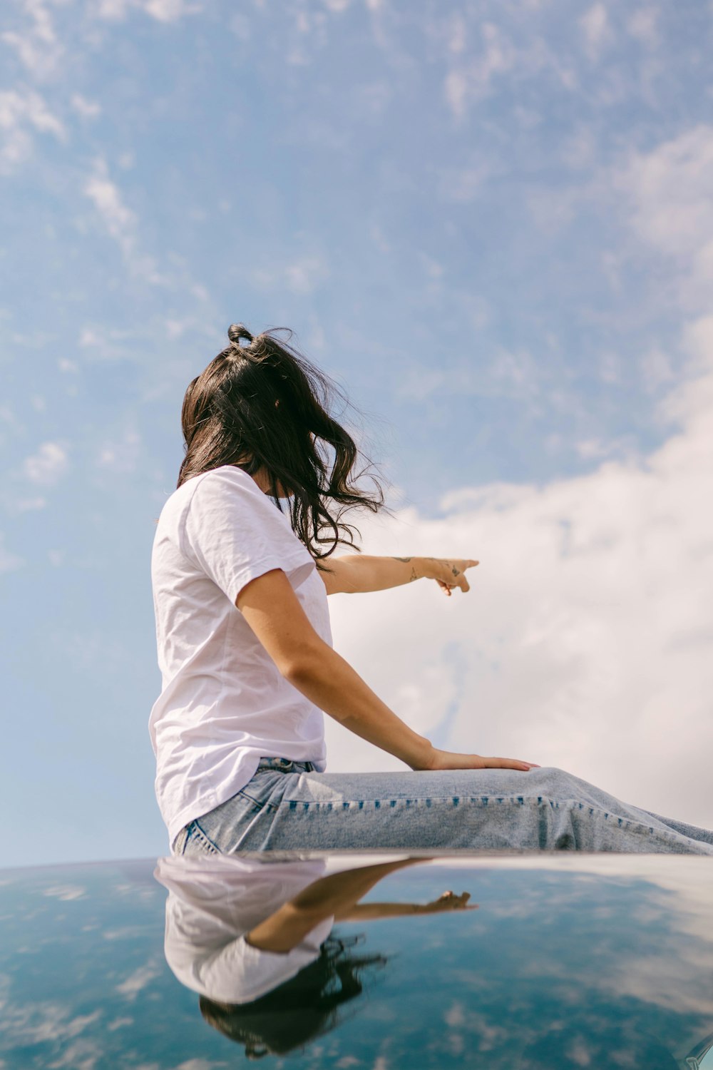 a person sitting on a ledge