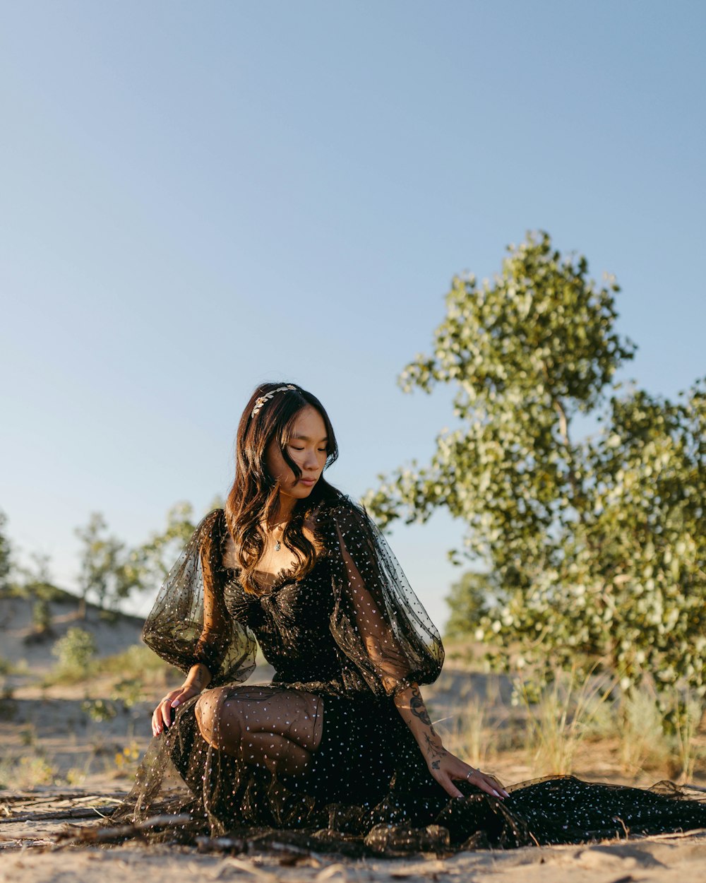 a woman sitting on the ground