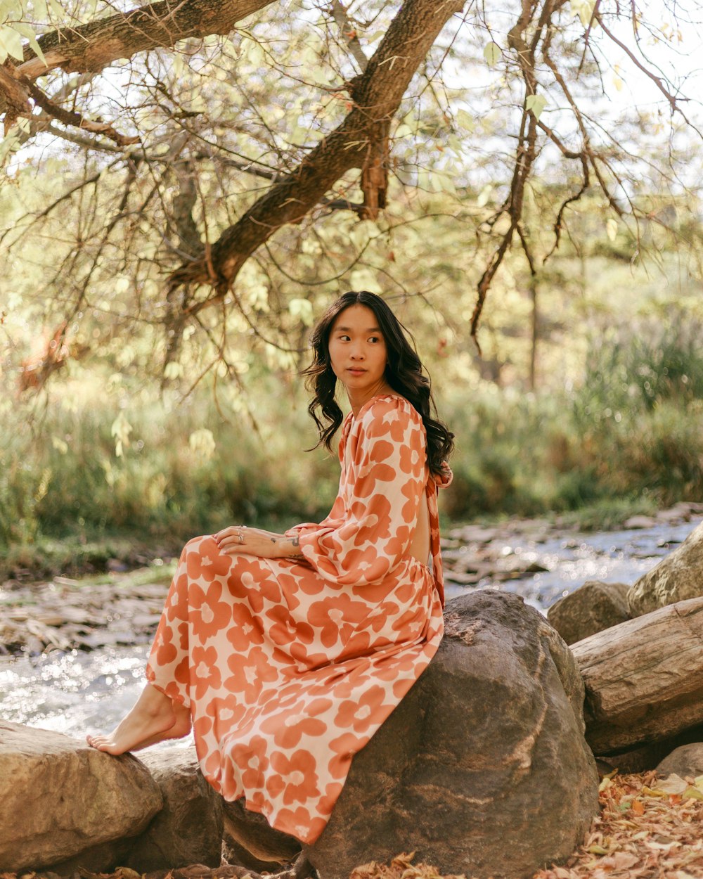 a person sitting on a rock