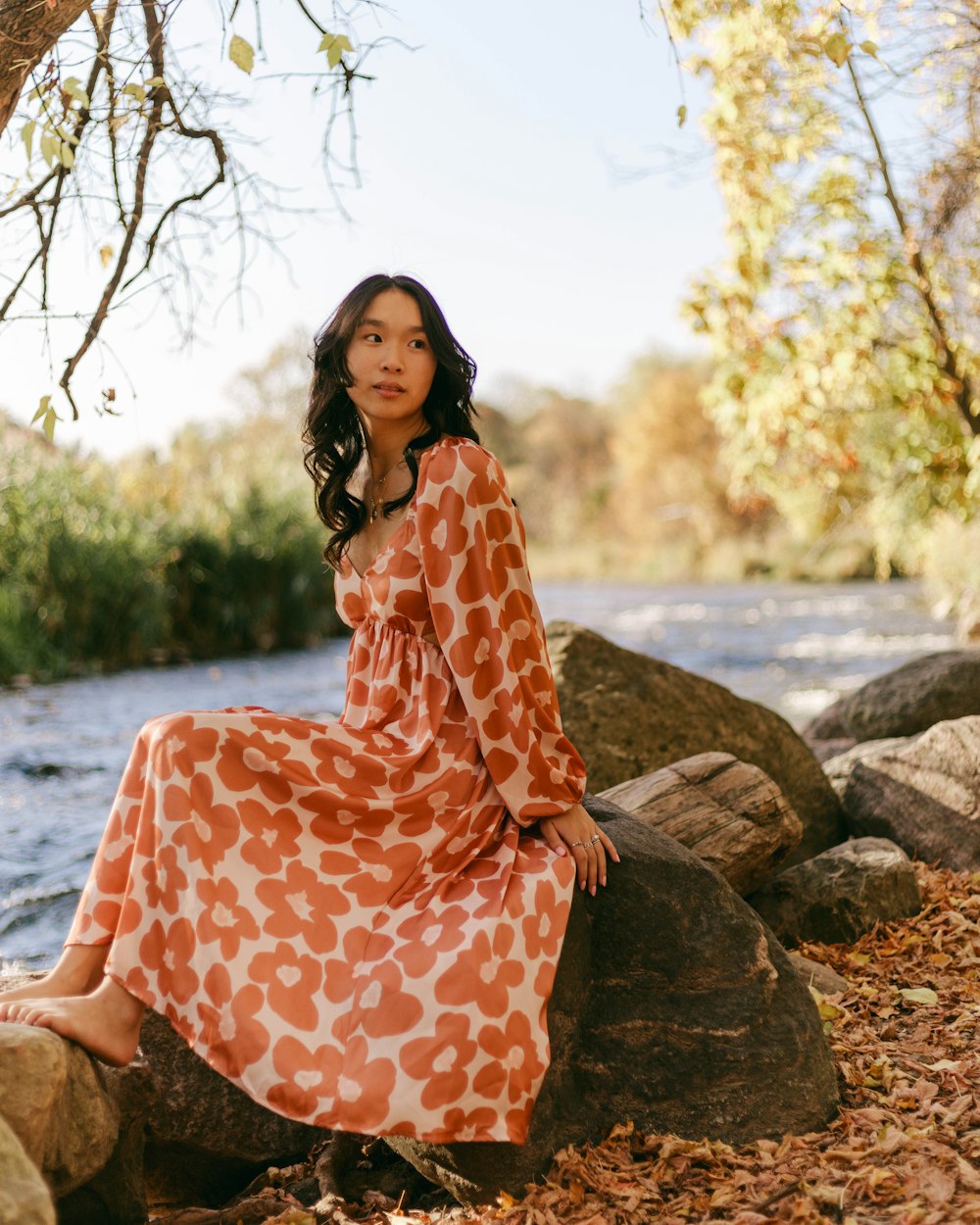 a person sitting on a rock