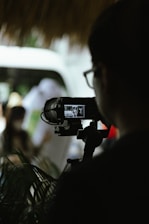A behind-the-scenes photo of a videographer at work.