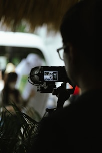 A behind-the-scenes photo of a videographer at work.
