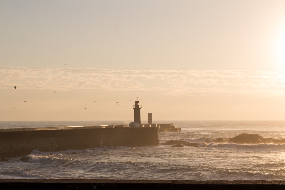 a lighthouse on a pier