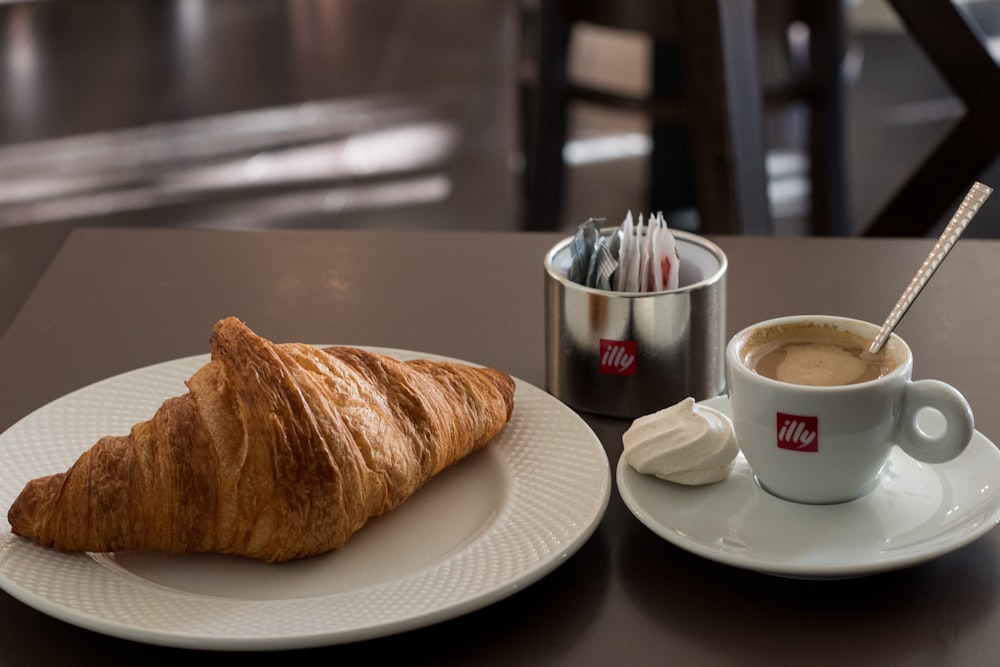 a plate of food and a cup of coffee