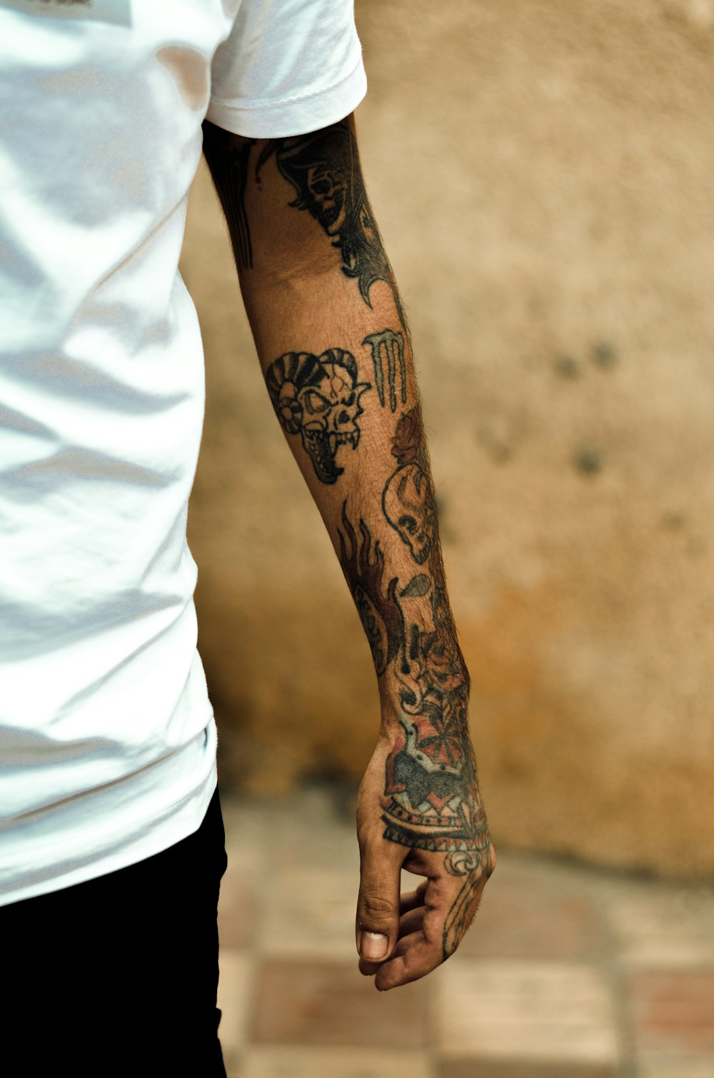 a person with tattoos on their arm