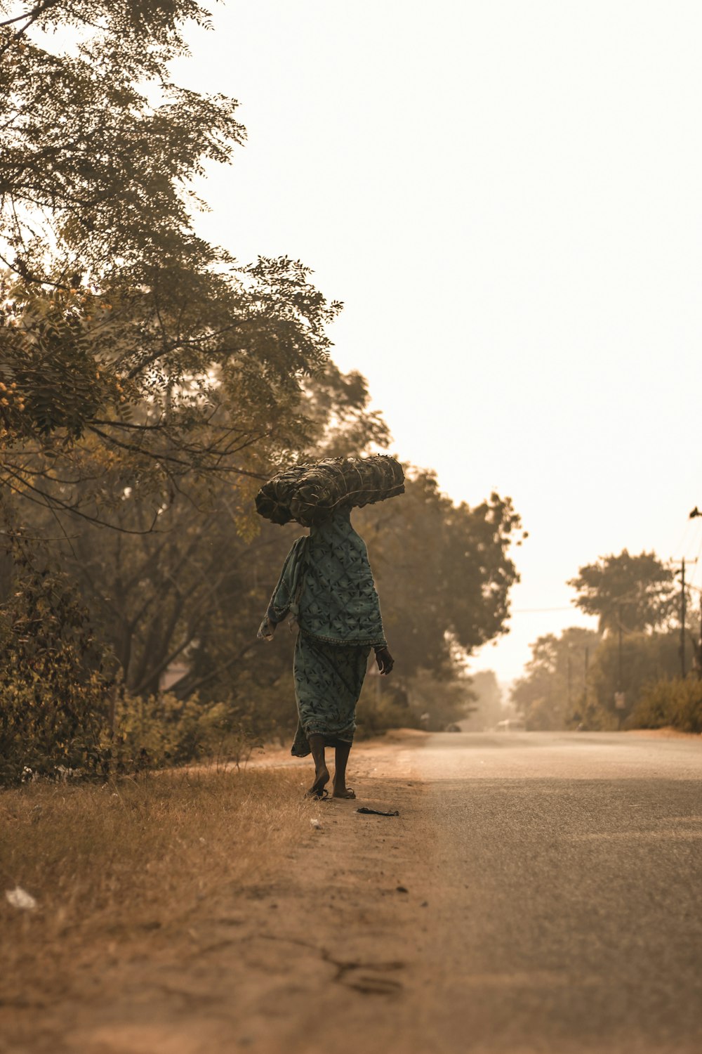 a man carrying a teddy bear