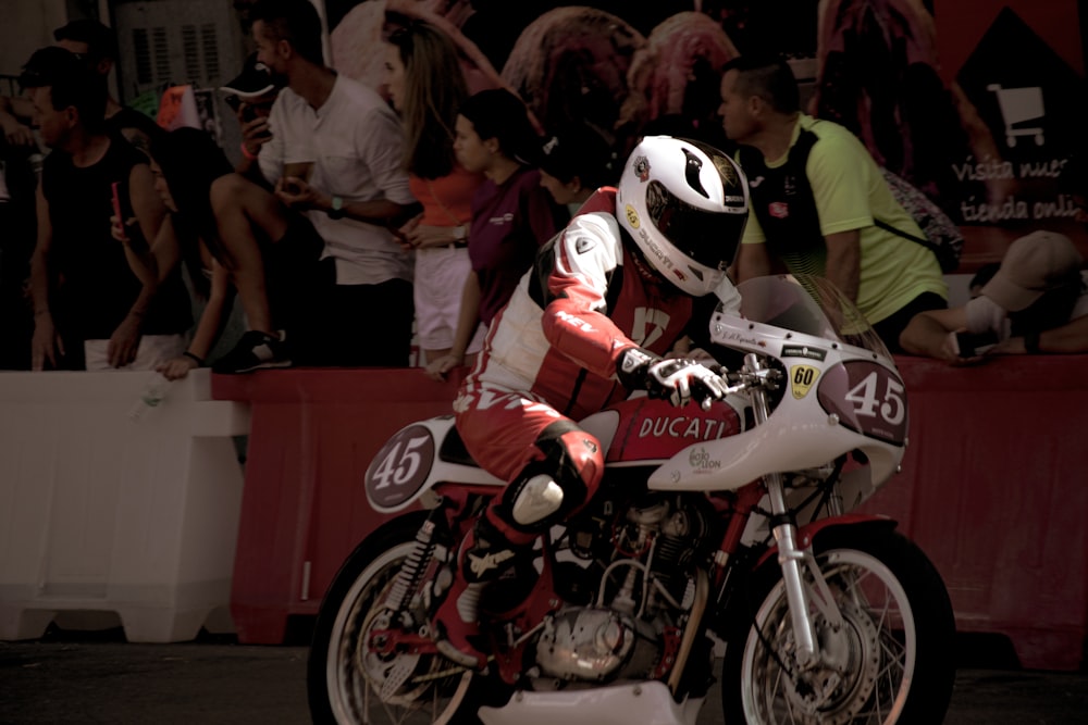 a couple of motorcyclists racing on a track