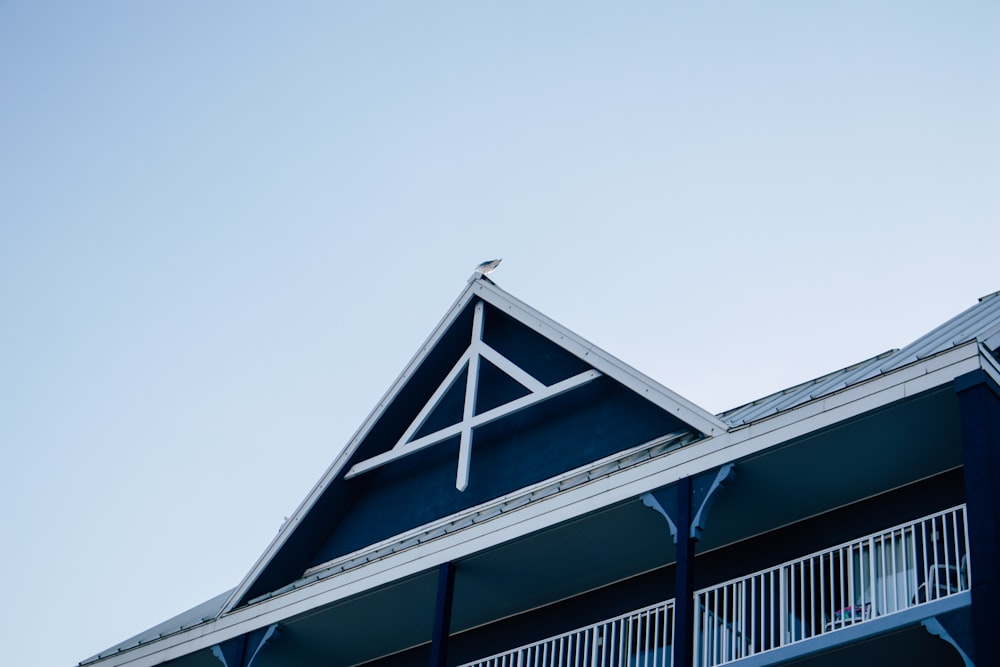 a bird sitting on a roof