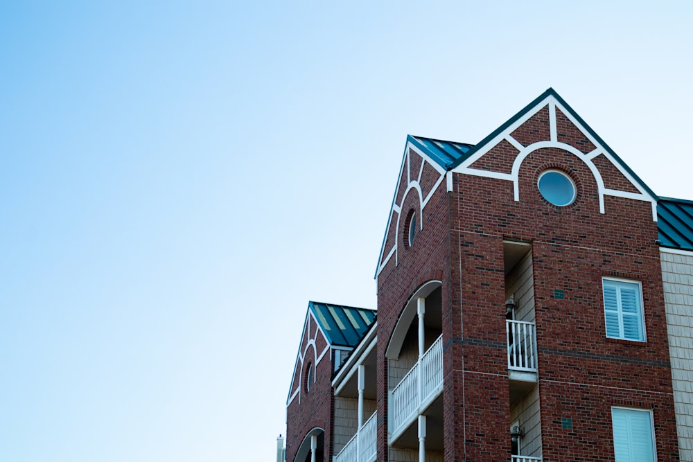 a brick building with a blue sky