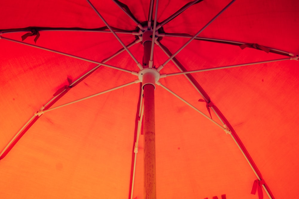 a red umbrella with a black frame