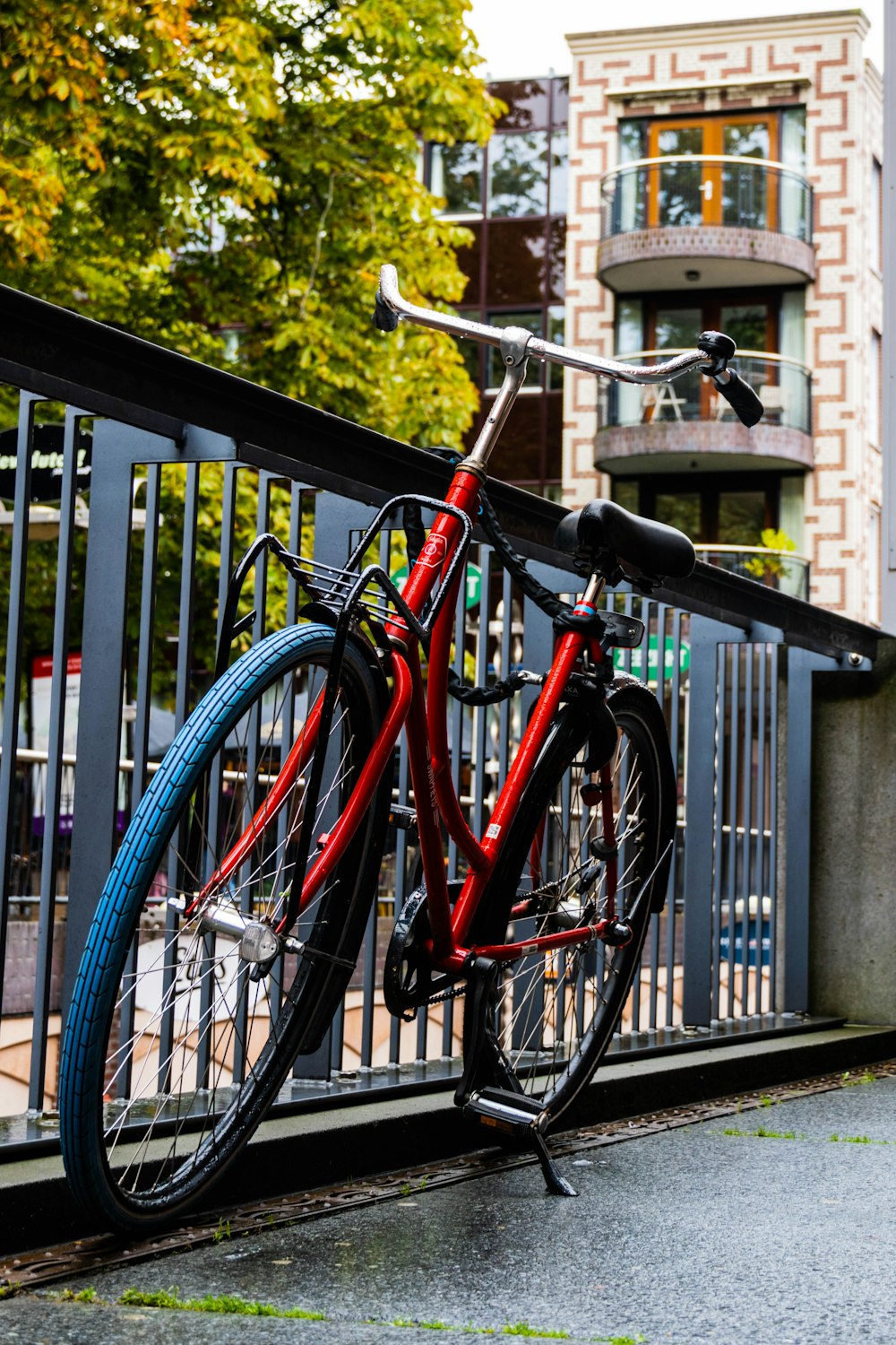 a bicycle parked on a fence