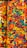 A vibrant assortment of colorful candy pieces, including star-shaped and crescent-shaped forms. The left side features multicolored star candies, while the right side contains a mix of rainbow-colored crescent candies, creating a visually striking pattern.