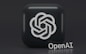 A 3D-style logo with a geometric design is prominently displayed on a dark, rounded square background. Below the logo, the word 'OpenAI' is written in a sleek, modern font.