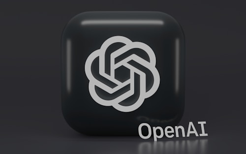 A 3D-style logo with a geometric design is prominently displayed on a dark, rounded square background. Below the logo, the word 'OpenAI' is written in a sleek, modern font.