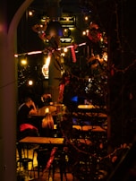 A cozy indoor venue set up for a 5forlove speed dating event with warm lighting.