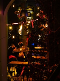 A cozy cantina setting with various creatures interacting in their custom habitats.