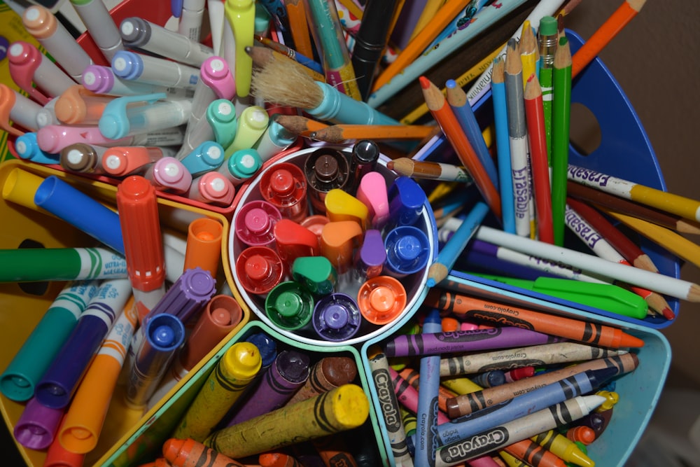 a group of colored pencils