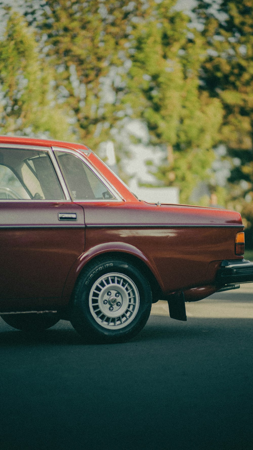 a red car parked on the side of the road