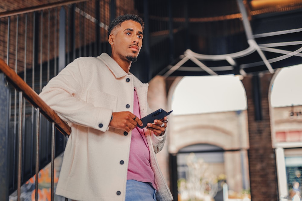 a man holding a tablet