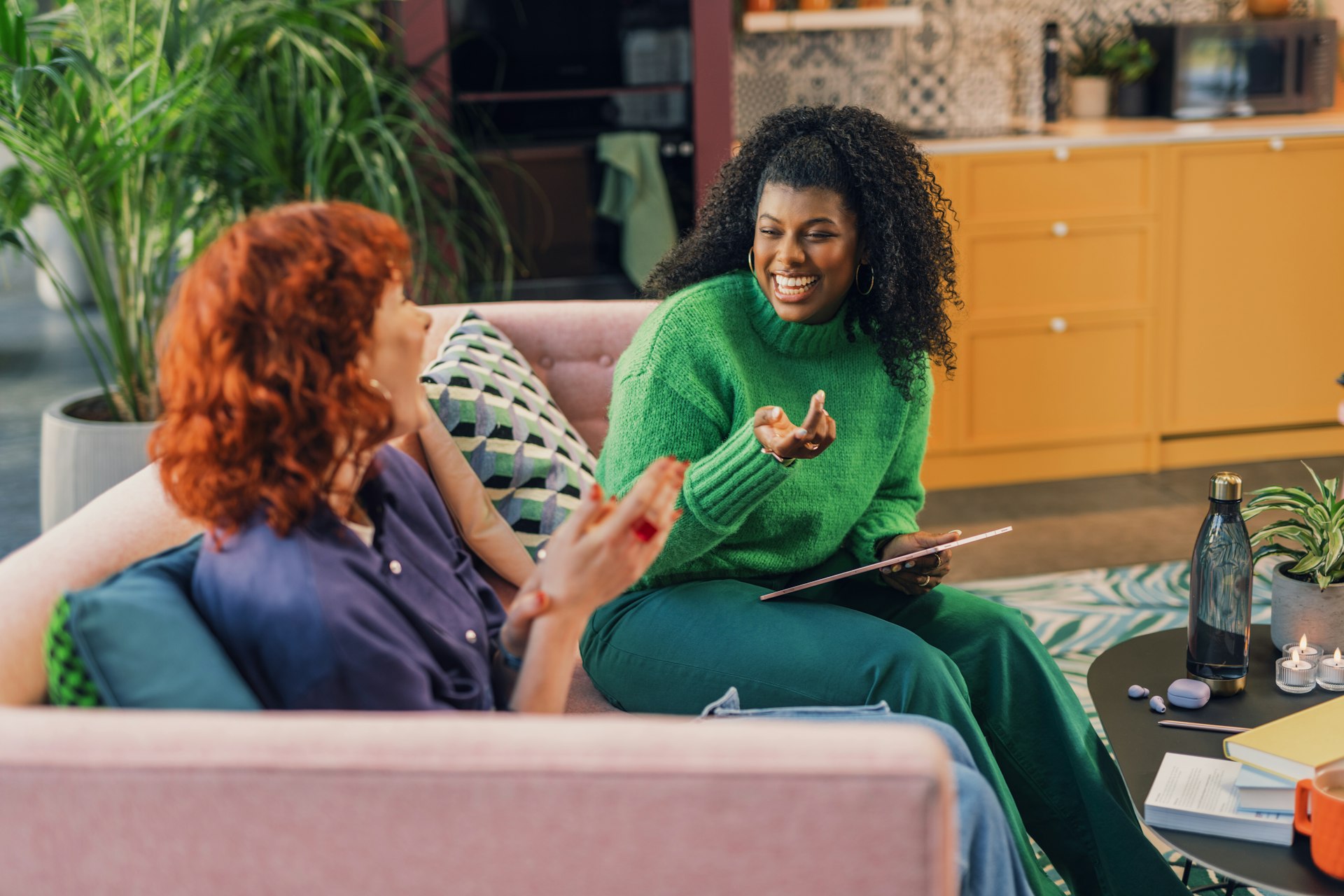 Image of two women conversing and laughing