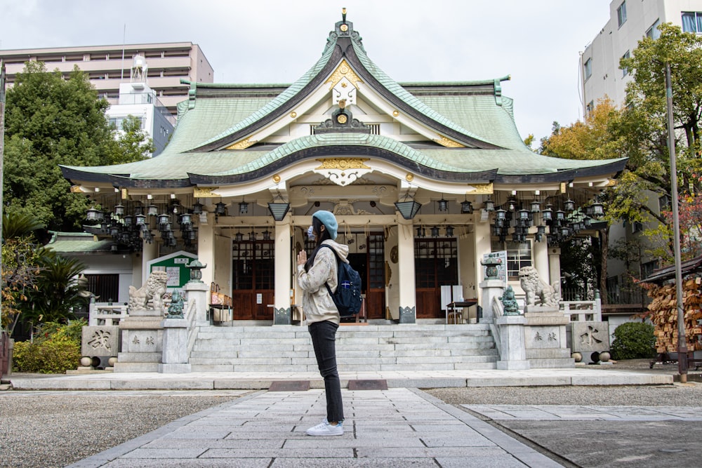 a man standing in front of a building