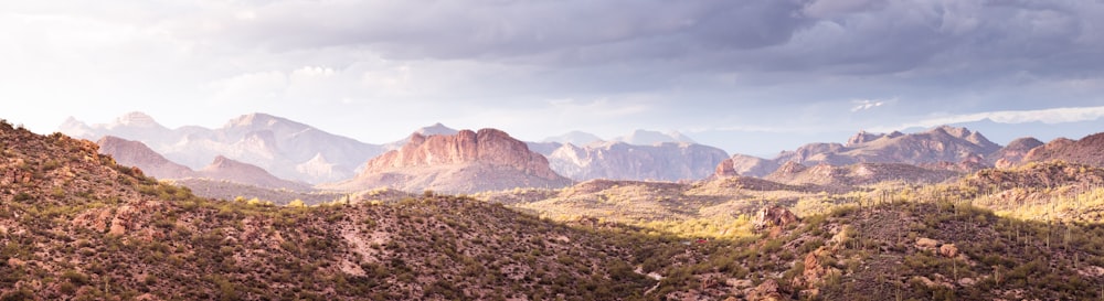 a landscape with mountains in the back