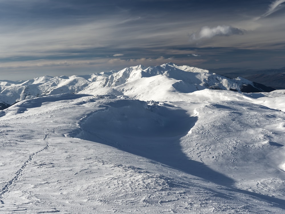 a body of water surrounded by snow