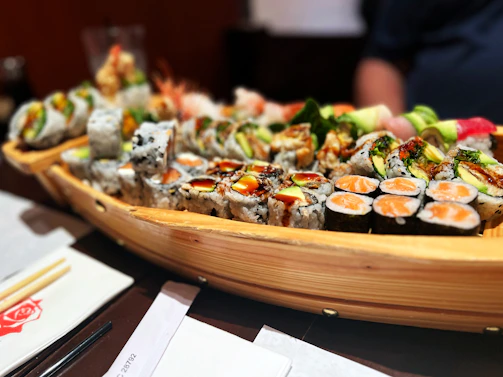 A creative sushi platter shaped like a swifty bird, blending Chase’s two passions.