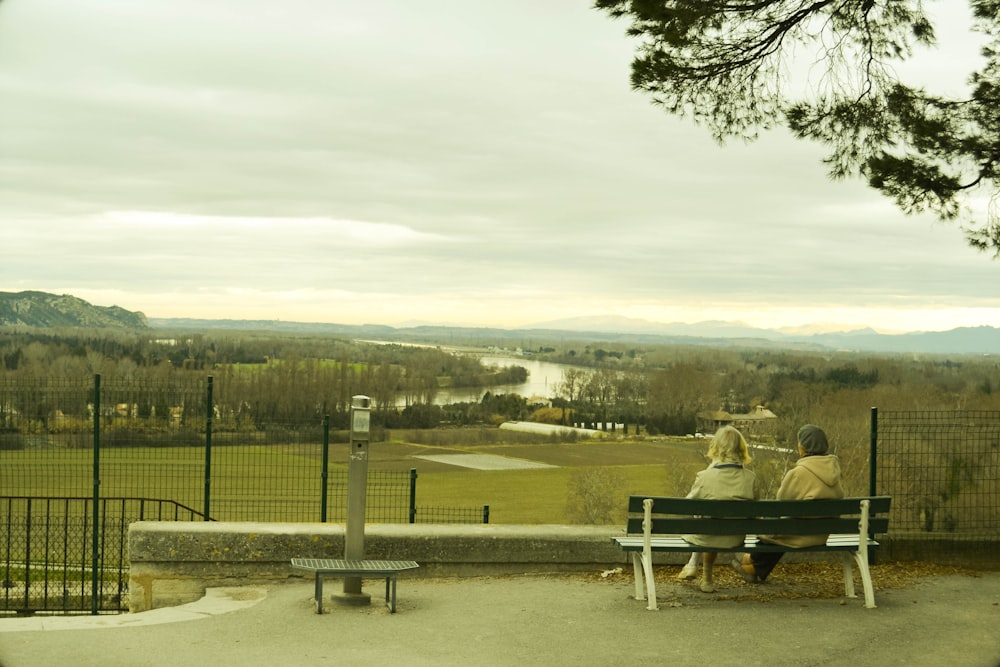 a couple sitting on a bench