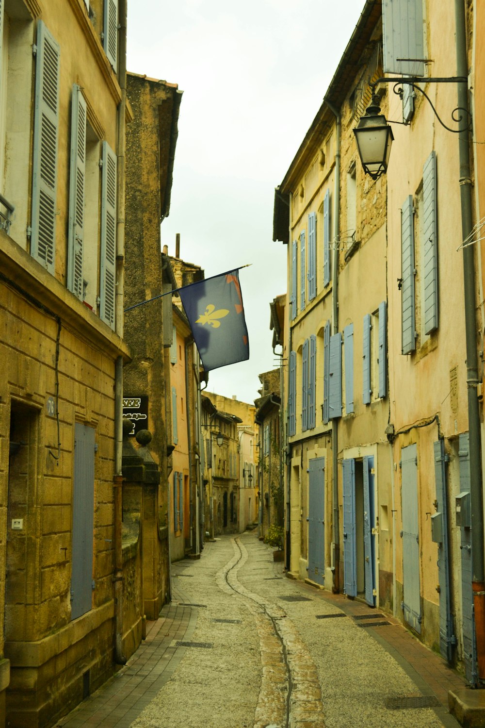 a narrow street with buildings on both sides