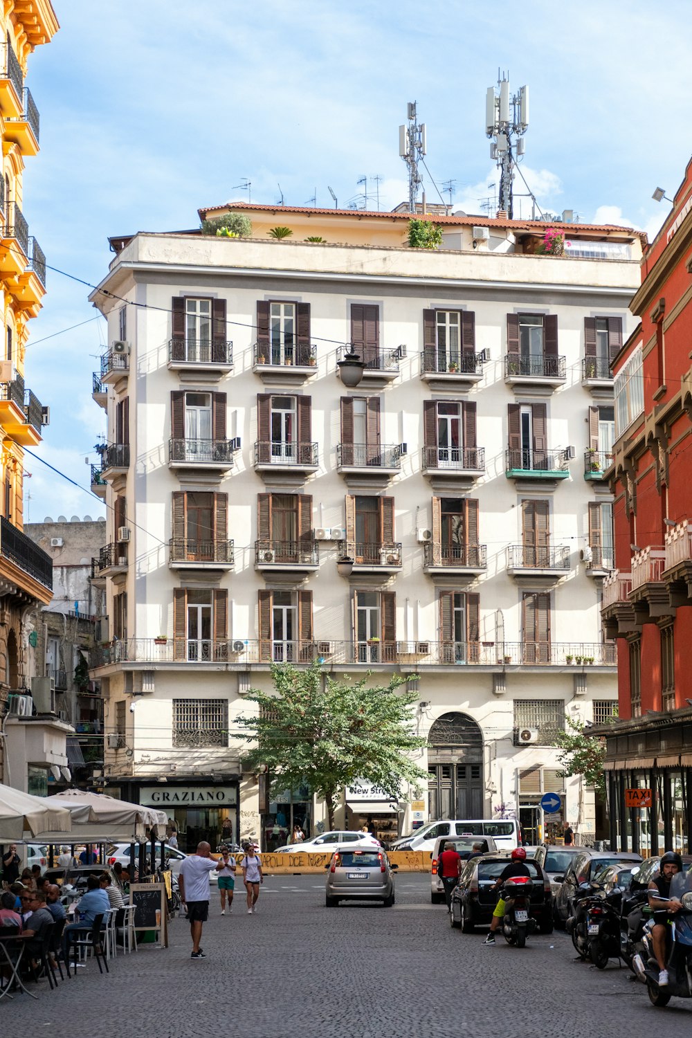 a street with cars and people on it