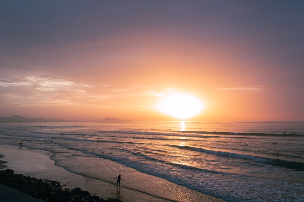 a beach with a sunset