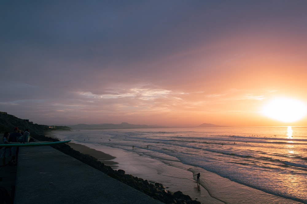 a beach with a sunset