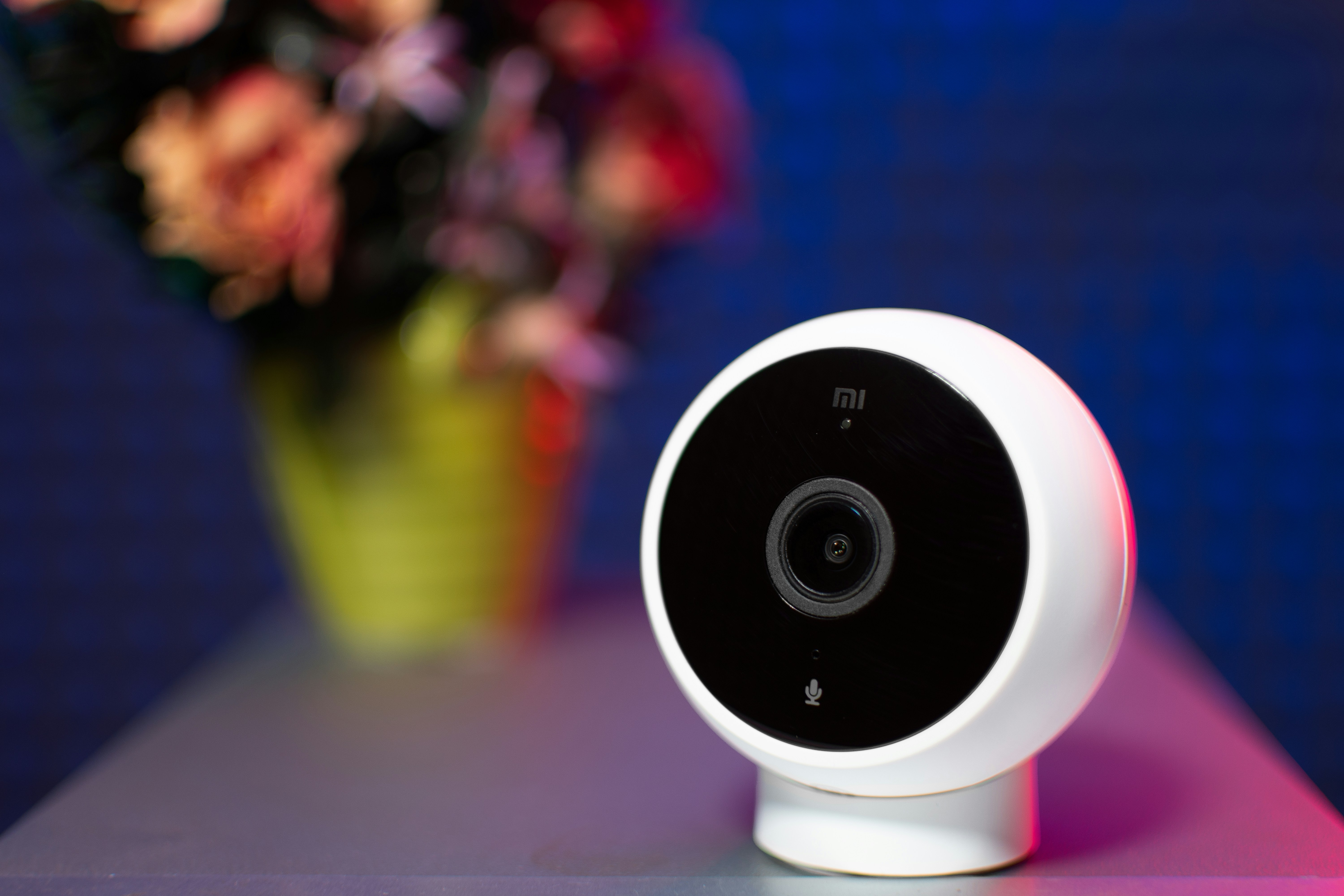 Xiaomi Home Security Camera in a Red-Blue Light Background