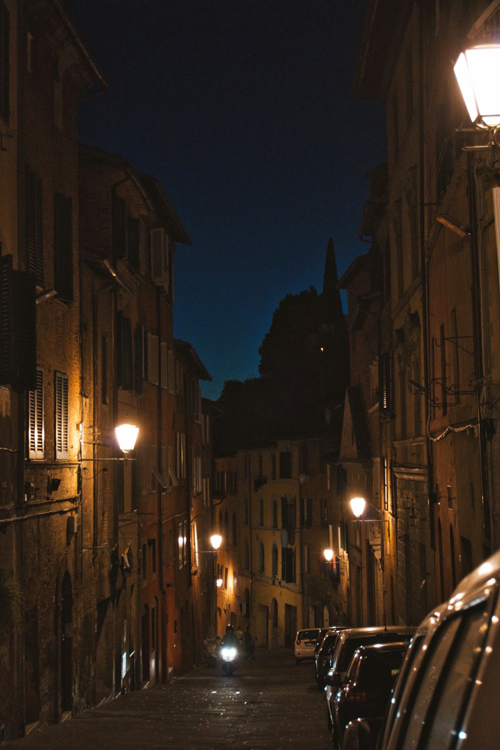 a street with cars on it at night