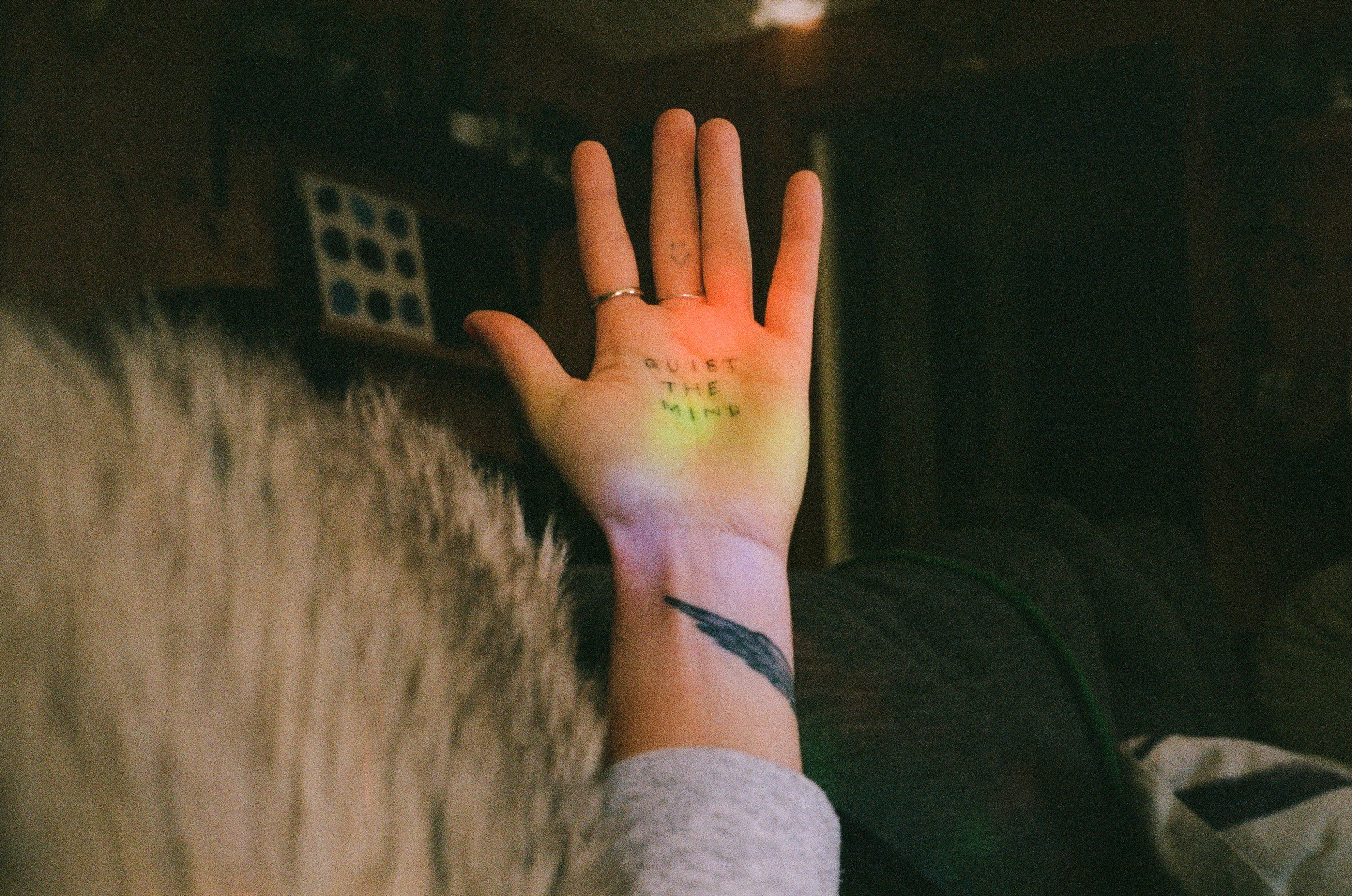 a hand with a tattoo on it