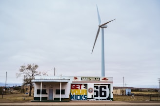 a building with a windmill in the background
