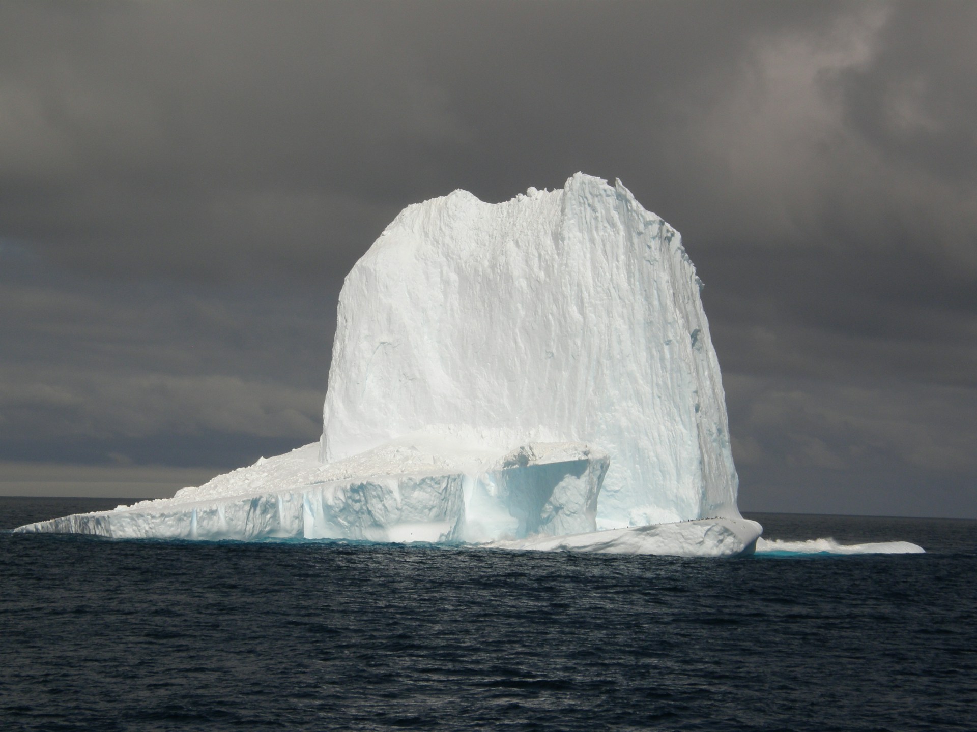 a large iceberg in the water