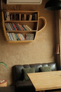 A cozy reading nook with self-help books and a warm cup of tea.