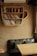 A cozy reading nook with a stack of colorful books and a steaming cup of tea.