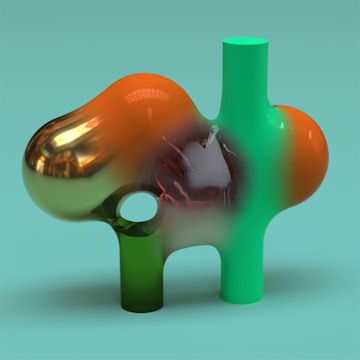 A vibrant abstract sculpture composed of interconnected geometric shapes featuring a smooth, shiny surface. The structure includes orange and green cylindrical forms with an organic, bulbous shape, and a reflective quality that suggests a metallic or glass-like finish. The background is a solid teal color, providing a contrasting backdrop.