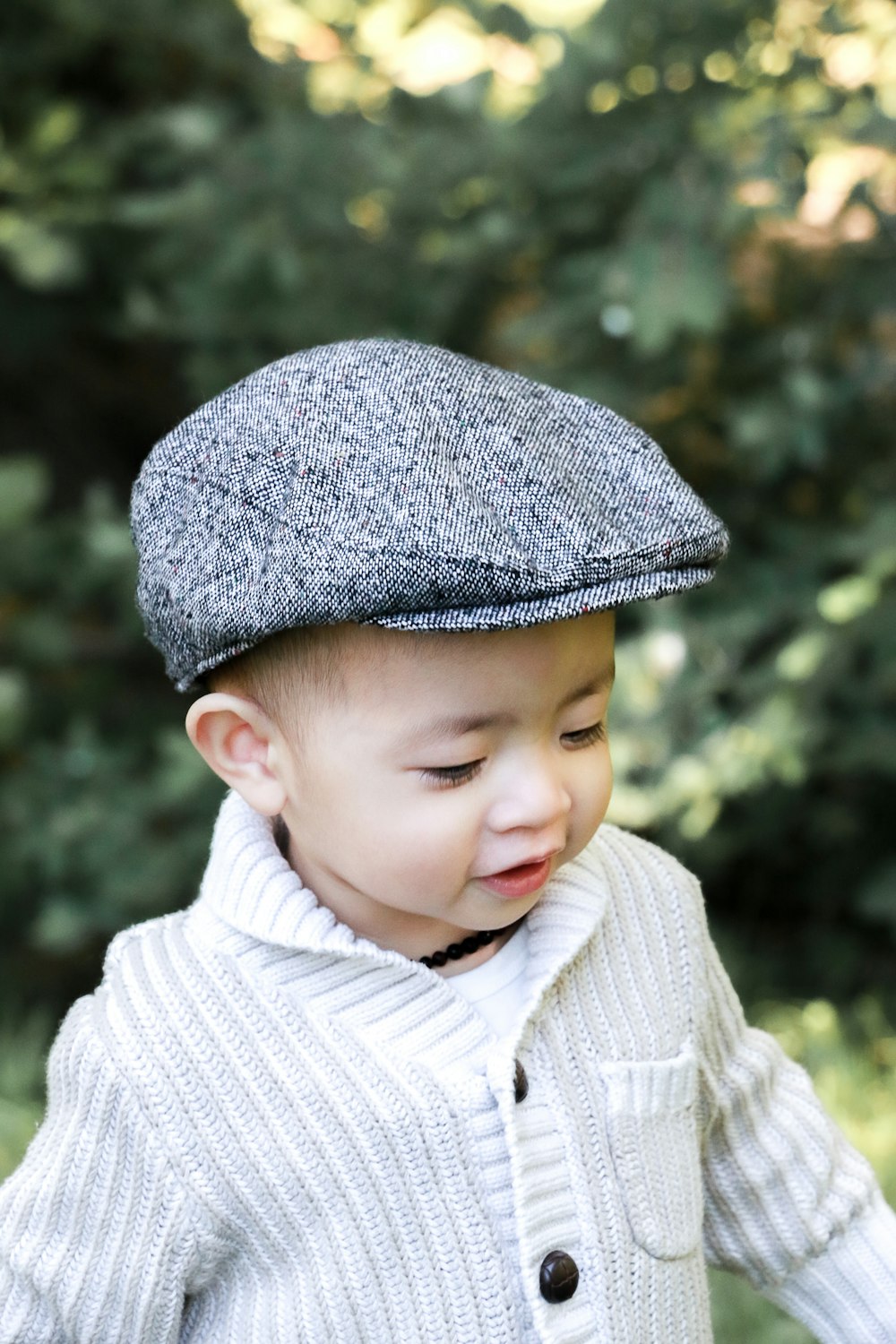 a young boy wearing a hat