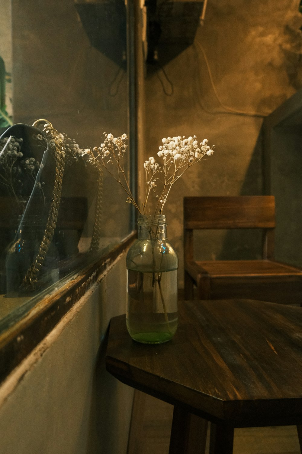 a vase with flowers on a table