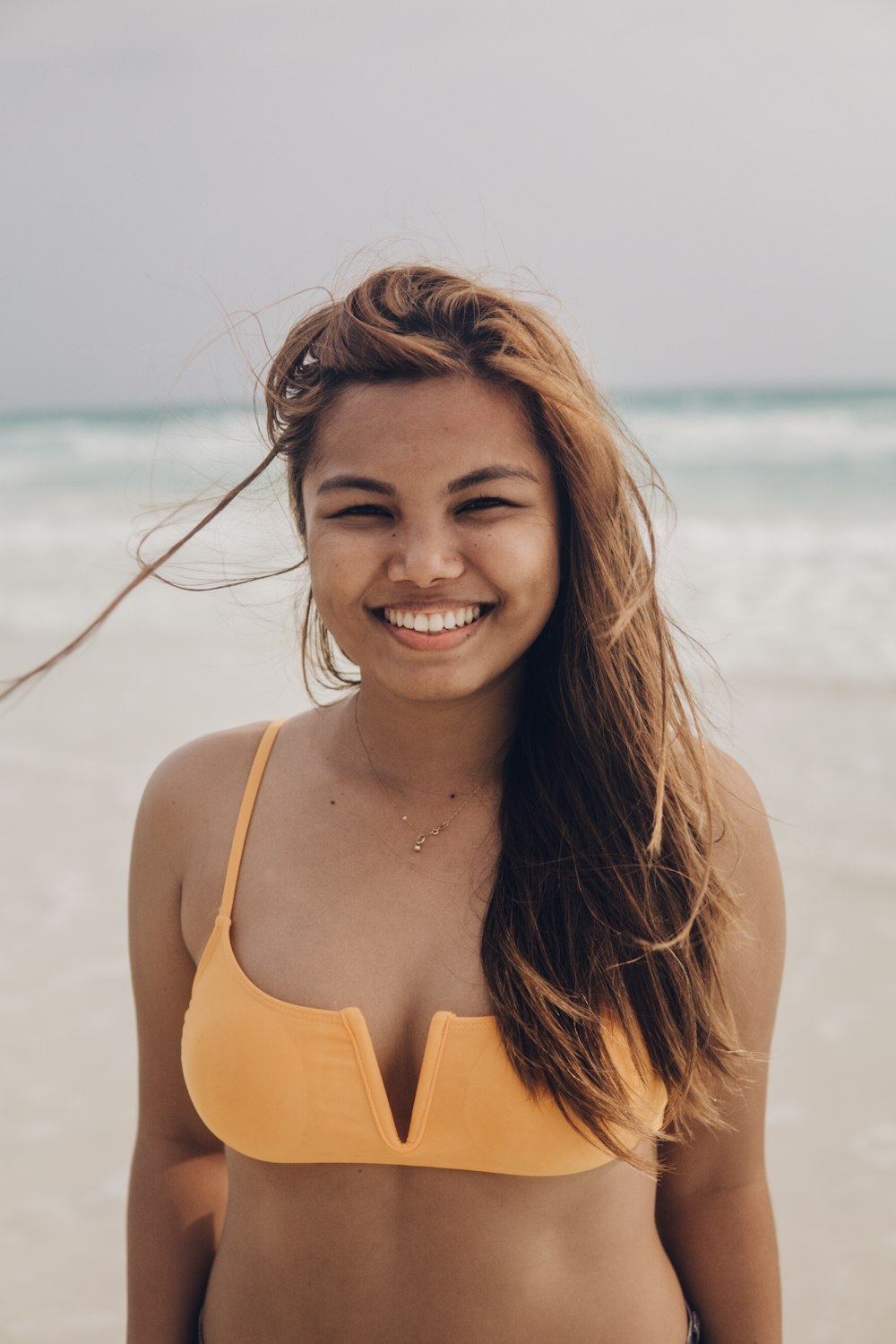 a woman smiling at the camera