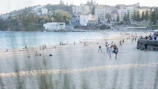 A lively beach scene with friends playing volleyball near the water at Ipanema.