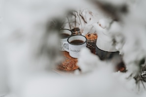 A warm, inviting scene with a cozy setting featuring a vintage-style mug filled with tea.