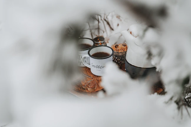 Guests enjoying a peaceful morning on the cottage’s terrace wrapped in cozy blankets with steaming cups of tea.