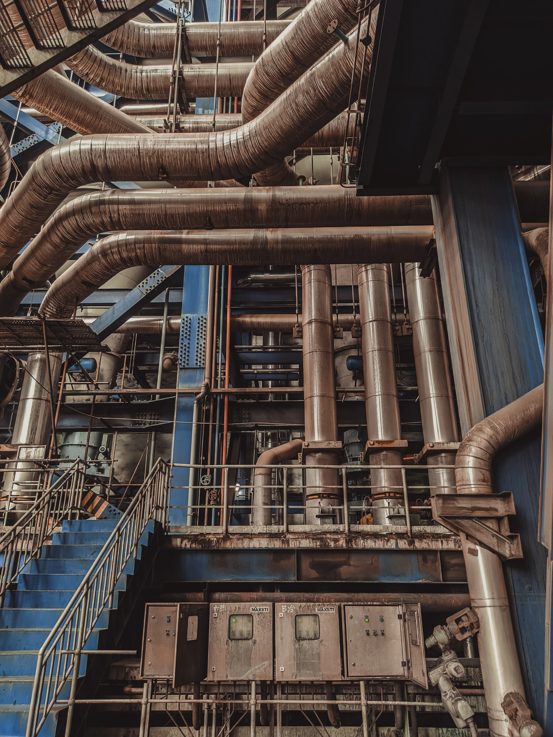 Large industrial plant with extensive piping - illustrative licensed stock photograph