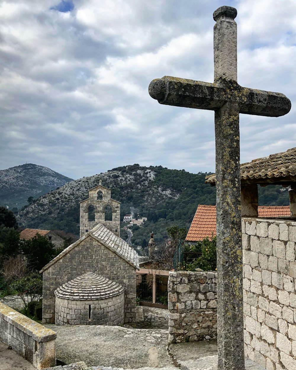 a cross in front of a building