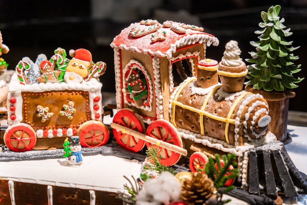 a gingerbread house with a train